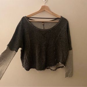 Free People dual grey sweater with frayed seam.